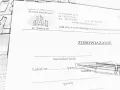 Szkic dokumentu "Zobowiązanie" spółdzielni mieszkaniowej z długopisem.