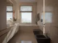 Nowoczesna łazienka z oknem na wprost drzwi, wanna, czarna miska WC i bidet, kamienne płytki, złote baterie.