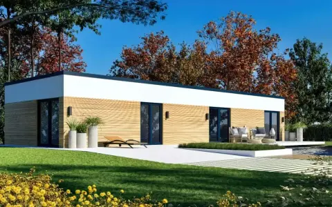 Nowoczesny dom modułowy 100m2 cena pod klucz, z drewnianą elewacją i dużymi przeszkleniami, otoczony zielenią i jesiennymi drzewami.